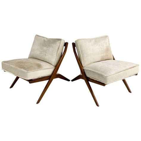 Cowhide cushions and pillows are a great piece to style your leather couch, or lounge chair. Folke Ohlsson Scissor Chairs with Brazilian Cowhide ...