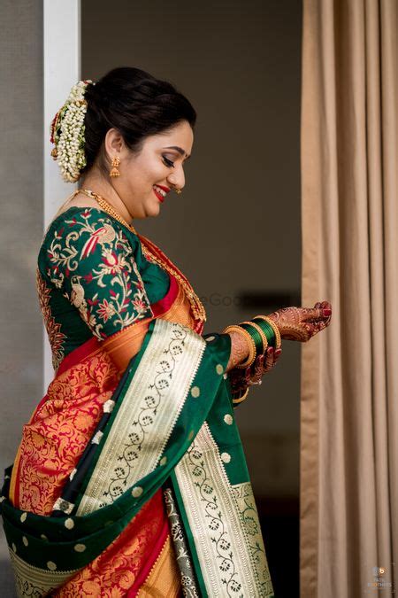 photo of a happy marathi bride in silk nauvari saree