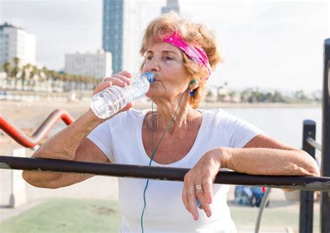 Portrait Of Mature Sportswoman Drinking Water Stock Image Image Of Healthy French