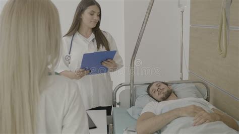 Hospital Nurses Taking Care Of A Male Patient Stock Video Video Of