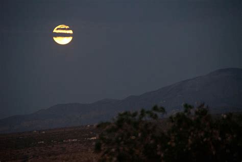 The Moon Rises Over Rwranch In The Beautiful High Desert