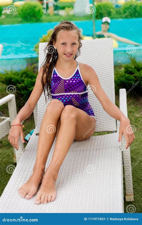 Young Girl In A Swimsuit On A Shelf By The Pool Stock Image Image Of Dive Beautiful 111971831