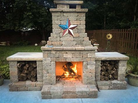 An Outdoor Fireplace With A Star On Top