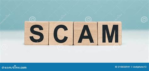 Scam Word Concept From Wooden Blocks On Blue Background Stock Image