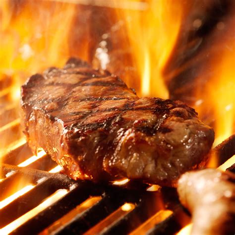 Beef Steak On The Grill With Flames The Butcher Shop Inc