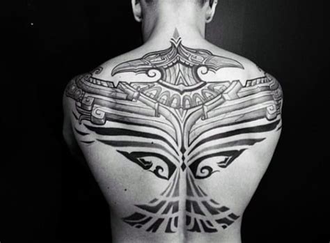 Inked in black, it is a stylish design idea for you. 60 Tribal Back Tattoos For Men - Bold Masculine Designs