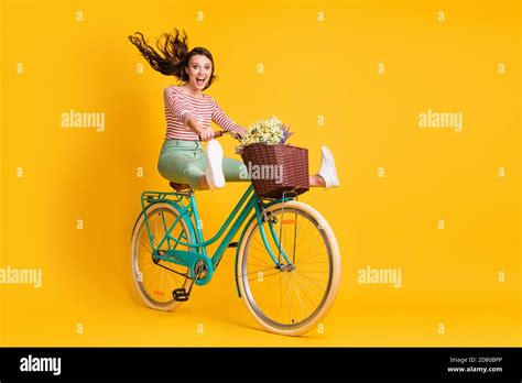 Full Length Body Size Photo Of Funky Girl Riding Bicycle Keeping Legs Up Screaming Isolated On