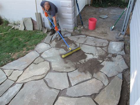 They eventually want to build the patio to end all patios, and this is their temporary and inexpensive option. The 12-hour DIY Flagstone Patio | merrypad