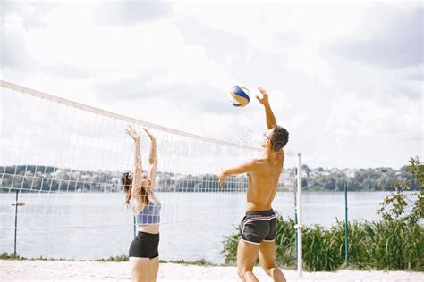 Young People Playing Volleyball On The Beach Stock Image Image Of