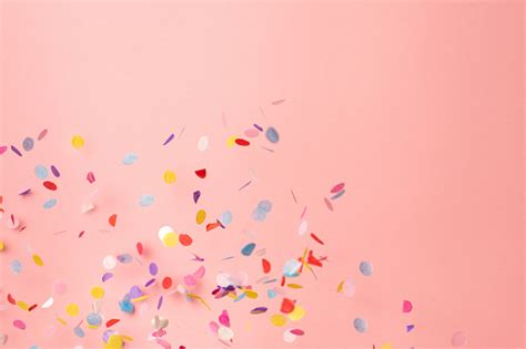 Colorful Confetti On Pastel Pink Background Bright And Festive Holiday