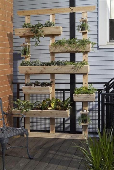 After the box planter is assembled, cut brackets to support the weight of the planter, dirt and this planter box is built with a top and a bottom exterior frame, with cedar panels affixed to the frame and bottom. Vertical Wooden Box Planter | The Owner-Builder Network