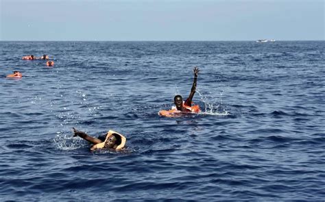 Photos Of African Migrants Stepping Over Dead Bodies After Being Rescued In The Mediterranean Sea