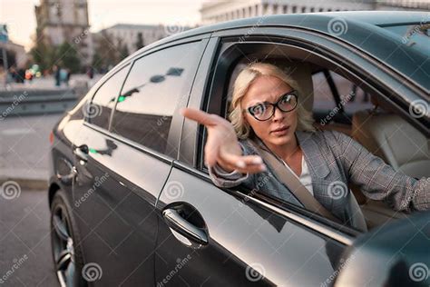 Troubles On The Road Portrait Of Angry Business Woman Gesturing With