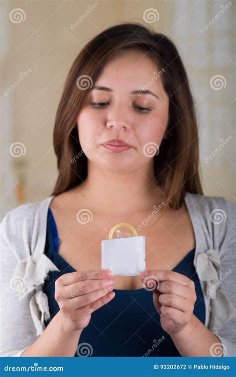 Beautiful Woman Open A Male Condom Package With Her Hands Signal With Her Hand Safe Sex