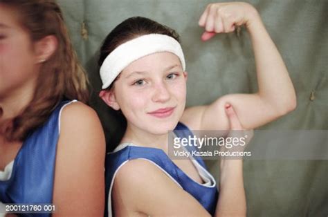 Girl Flexing Bicep Portrait Photo Getty Images