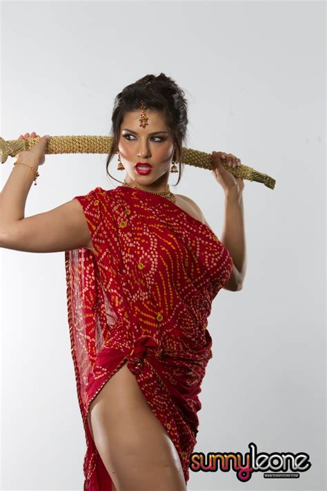 Oiled Up Sunny Leone Teasing With A Big Sword