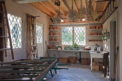 The shed's interior makeover focused on creating a garden work space, keeping tools off the floor and adding storage. Designing the Perfect Garden Shed - Katahdin Cedar Log Homes