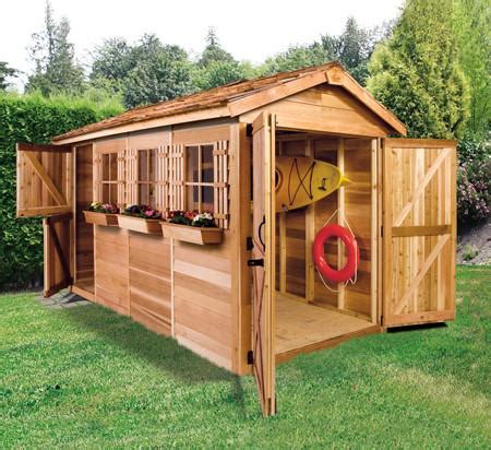 A hideaway storage space for smaller objects. Small Boat House, Boathouse Plans, Kayak Shed, Canoe ...