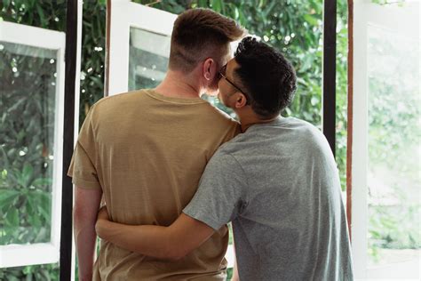 Man Kissing Another Man On The Cheek · Free Stock Photo