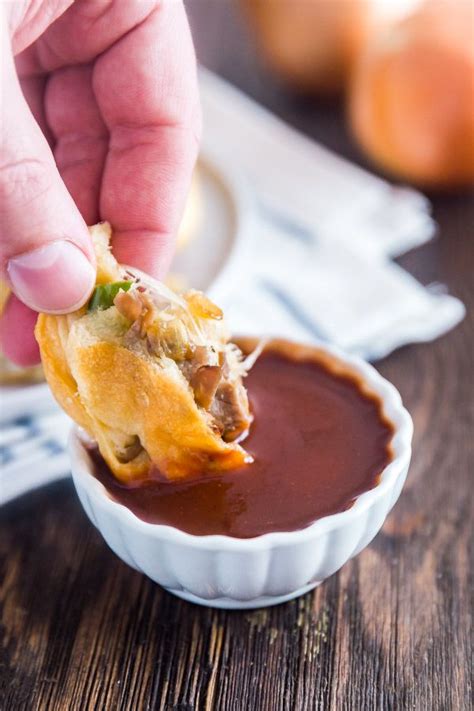 Philly cheese steak wrapped in a flaky crust and bake to perfection! A piece of a Philly Cheese Steak Stuffed Bread Roll being ...