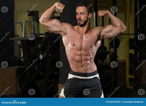 muscular men is hitting rear double bicep pose stock image image of biceps lifestyles 63724709