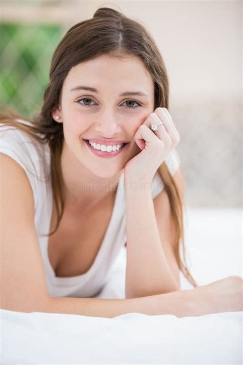 Portrait Of Smiling Woman Lying On Bed Stock Image Image Of Home