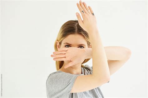 Girl Bending Arms Covering Her Face By Stocksy Contributor Guille Faingold Stocksy