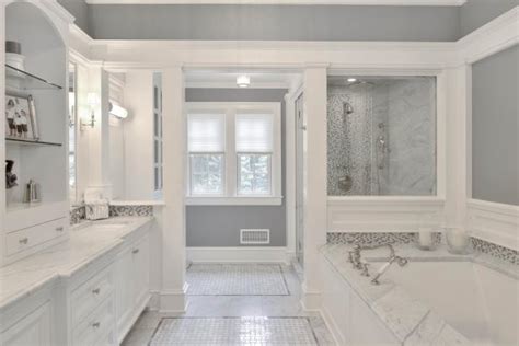 Koi bathtub is a freestanding bathtub with base in aged brushed brass, and the interior in aged brushed iron. Spa-Like Master Bathroom Boasts Gray and White Palette | HGTV