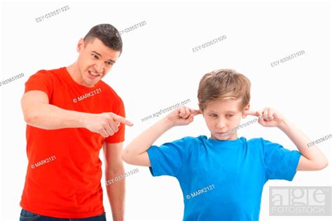 Father Shouting At Son Angry Father Shouting At His Son While Child
