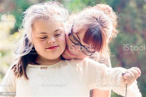 Portrait Of A Mother With Her Daughter Of 12 Years Old With Autism And