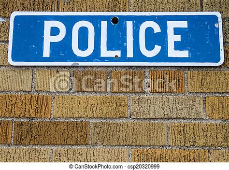 Police Station Sign On Brick Wall In Horizontal Orientation With Copy