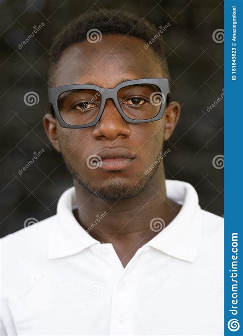 Face Of Young African Nerd Man Wearing Eyeglasses Outdoors Stock Image