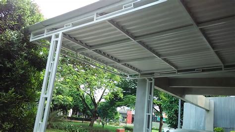 Atap alderon dengan atap upvc merk lainnya bila dilihat dari gambar akan sama persis, karena struktur yang dimiliki sama gelombang berongga warna yang dimiliki adalah putih dan biru dengan dua tipe yakni doff dan semi transparan. Gambar Kanopi Atap Alderon - DhigJaya Steel