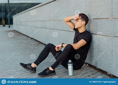 Man Sitting On The Ground Stock Photo Image Of Health 128837754