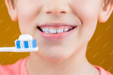 Premium Photo Dental Hygiene Happy Little Kid Brushing Her Teeth Kid