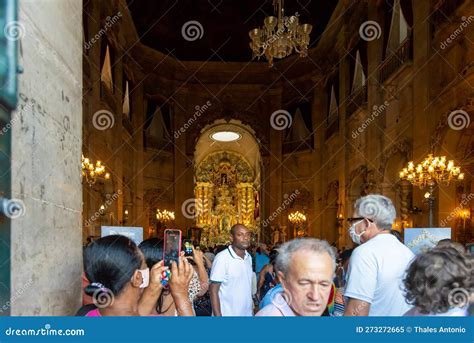 hundreds of catholic faithful are praying during the homage to nossa senhora da conceicao da