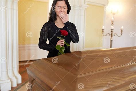 Crying Woman With Red Rose And Coffin At Funeral Stock Image Image Of