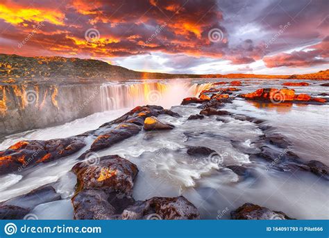 Dramatic Sunset View Of Fantastic Waterfall And Cascades Of Selfoss