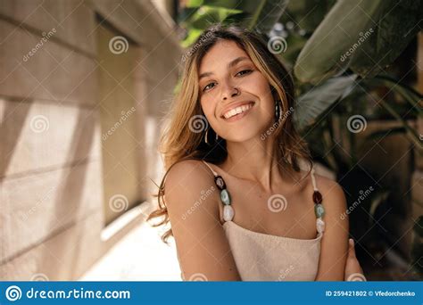 Happy Young Caucasian Woman With Piercing Smiles Teeth Relaxing