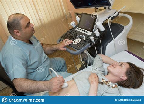 Ultrasound Examination At The Doctor Of A Young Girl Stock Photo