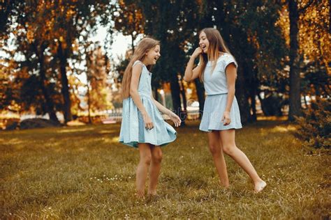 Two Cute Girls Have Fun In A Summer Park Stock Image Image Of Hair
