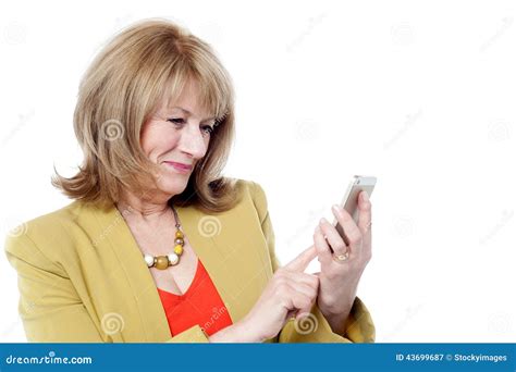 senior woman looking at her cell phone stock image image of attractive model 43699687