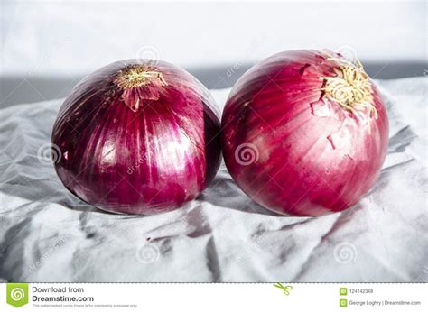 Two Red Onion`s One Showing The Top And One Showing The Bottom Stock Photo - Image of states ...
