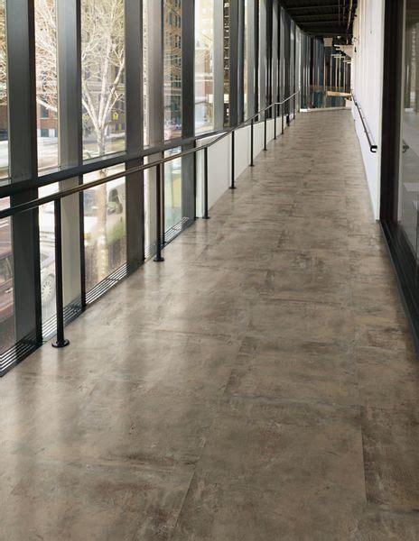 You'll want to make sure the reducer's curved end leads down to the vinyl for a smooth transition. Luxury Vinyl Tile - Bleck & Bleck Architects