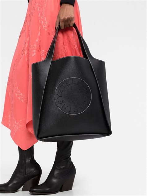 Stella Mccartney Perforated Logo Vegan Leather Tote Bag In Black Modesens