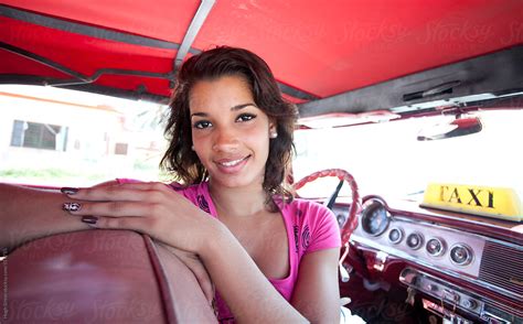 portrait of cuban woman in taxi havana cuba by stocksy contributor hugh sitton stocksy