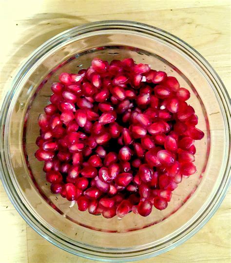 Carefully pull the pomegranate apart with your hands. How to cut a pomegranate without making a mess - You Bet ...