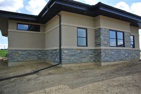 House front elevation design single floor. Linear House Design with Stone Exterior