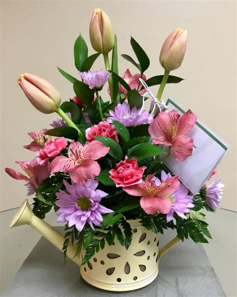 Zillow predicts the home values in 46227 will increase 7.5% (↑) in the next year. How cute is this watering can arrangement?! #shoplocal # ...