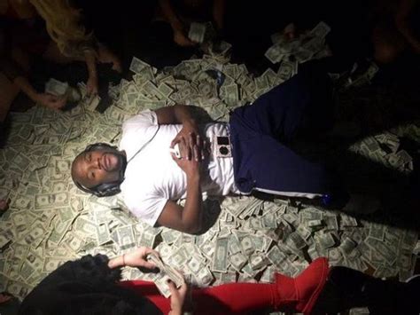 Floyd Mayweather Lies On A Bed Of Money In New Photo